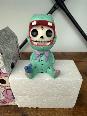 Mint Skeleton Dino Figurine Toy with Purple Bow
